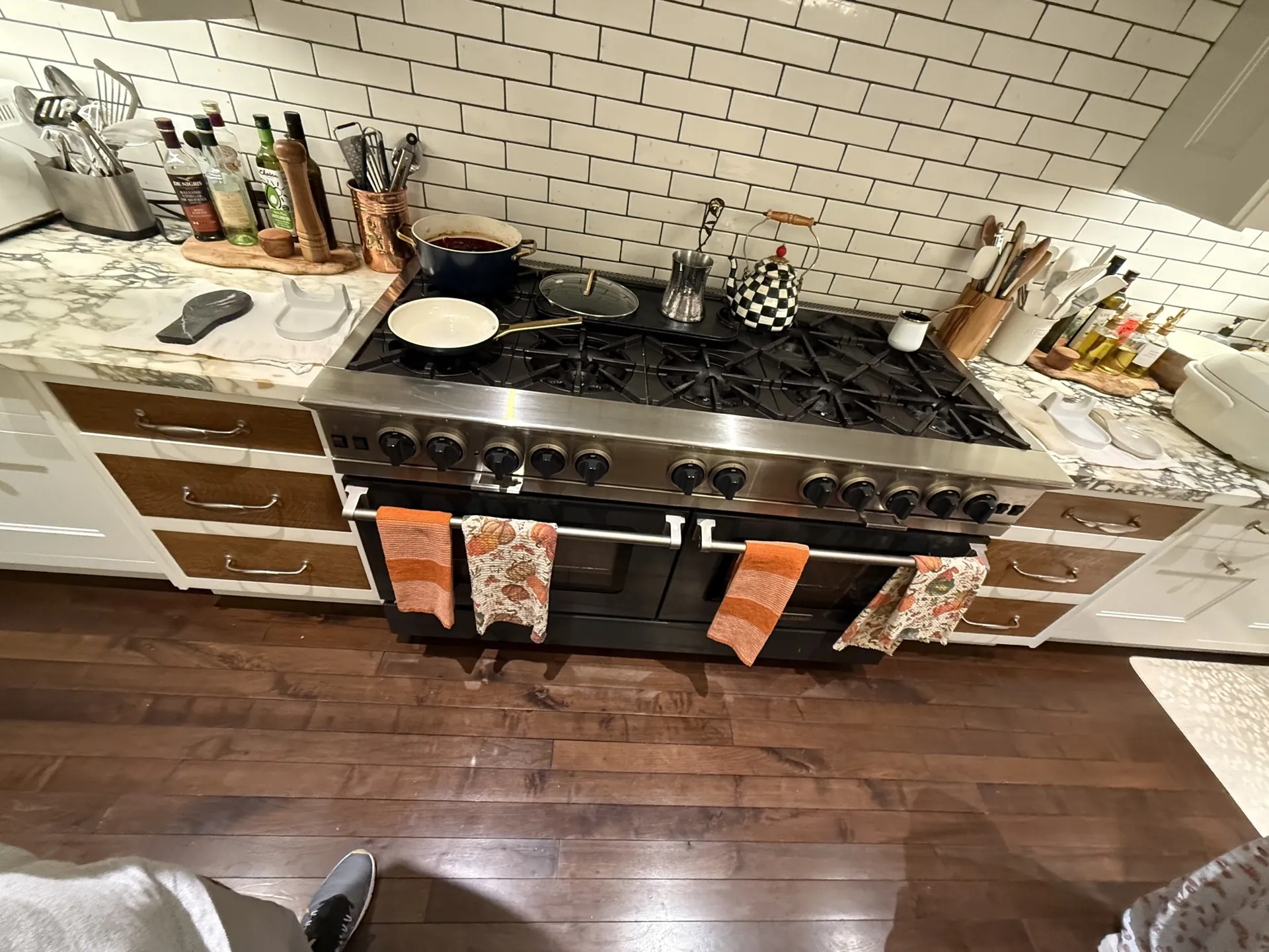 A BlueStar range in a kitchen with a marble counter