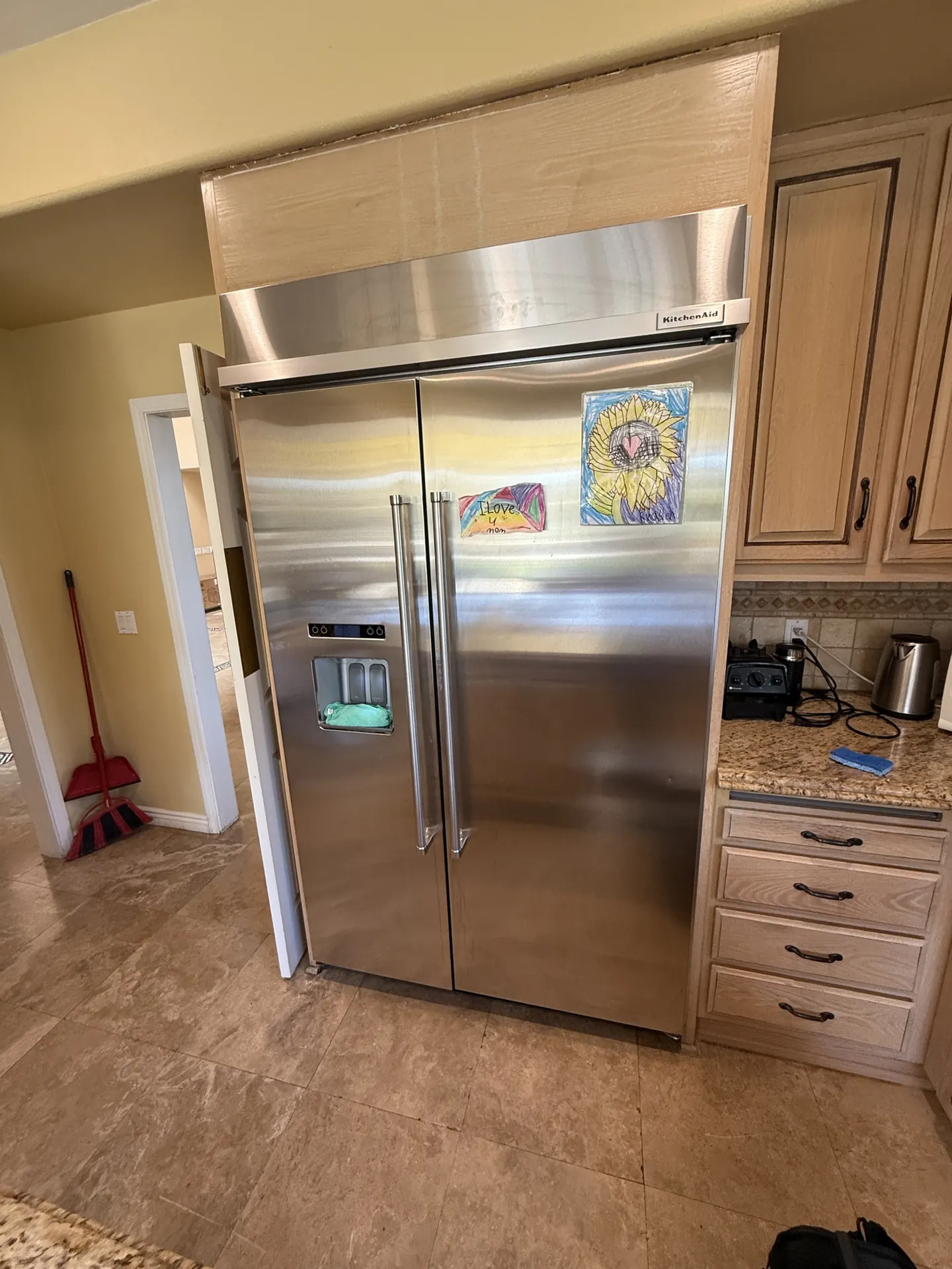 A built-in refrigerator in a remodeled kitchen