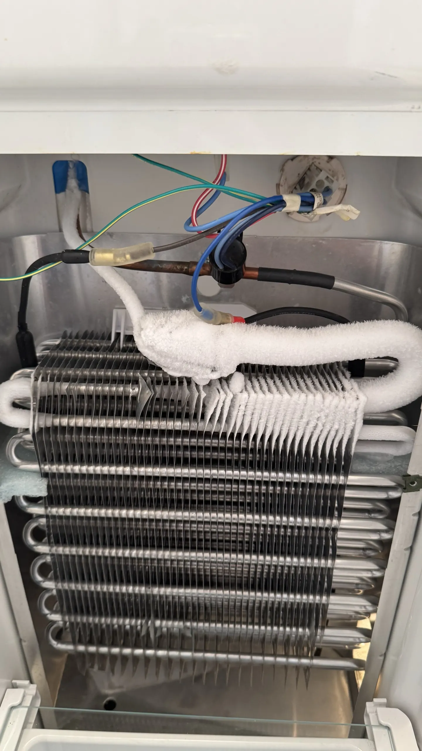 An evaporator coil and fan assembly removed for repair