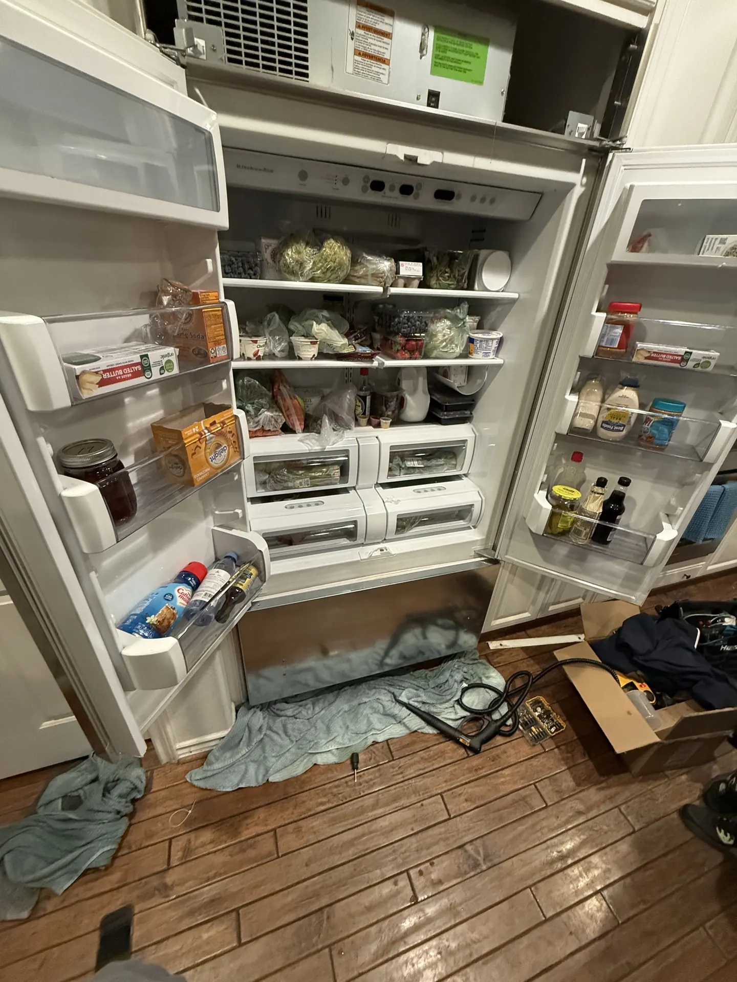 An open refrigerator in a Van Nuys kitchen after the repair