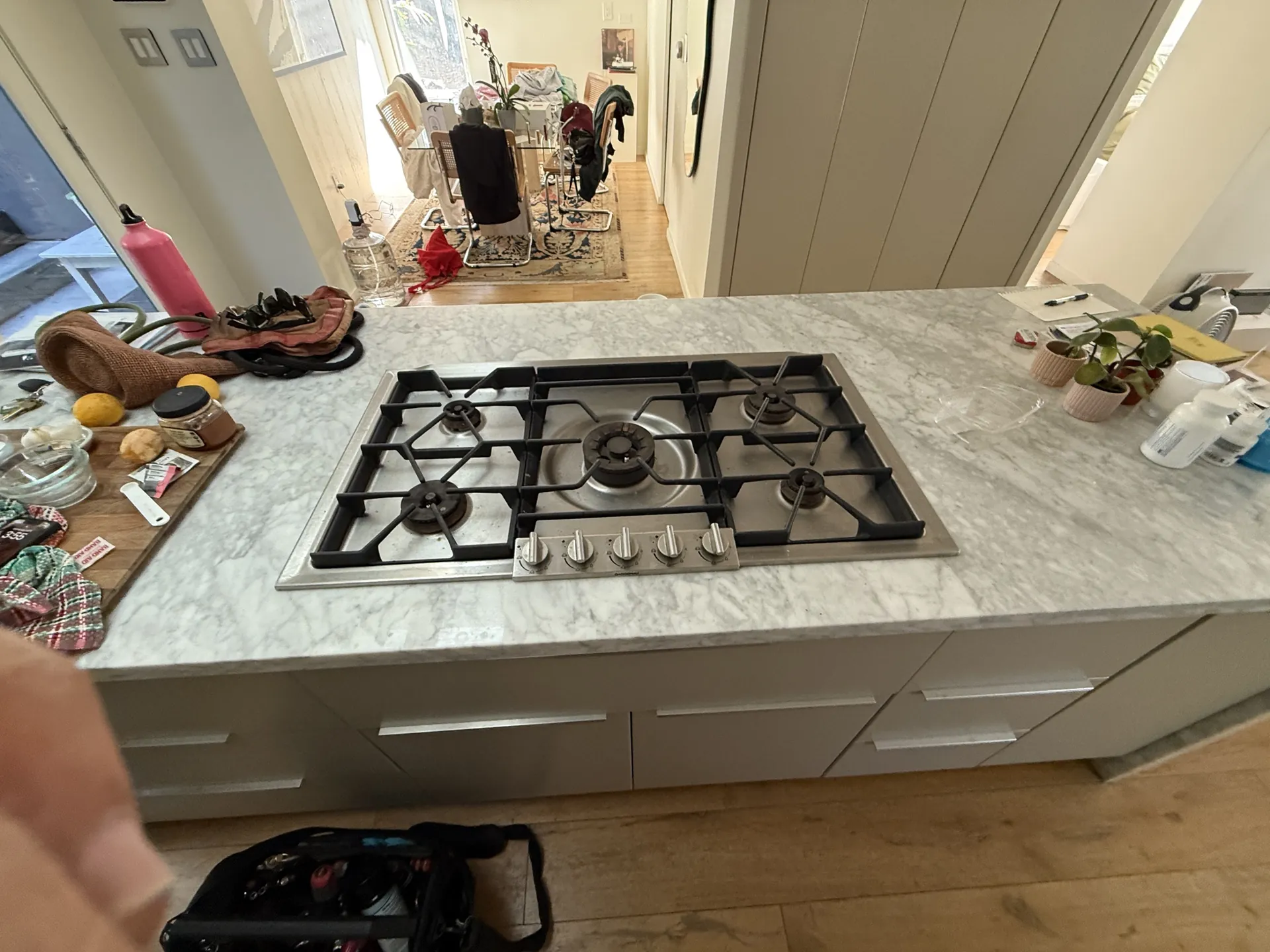 A gas cooktop set into a kitchen island