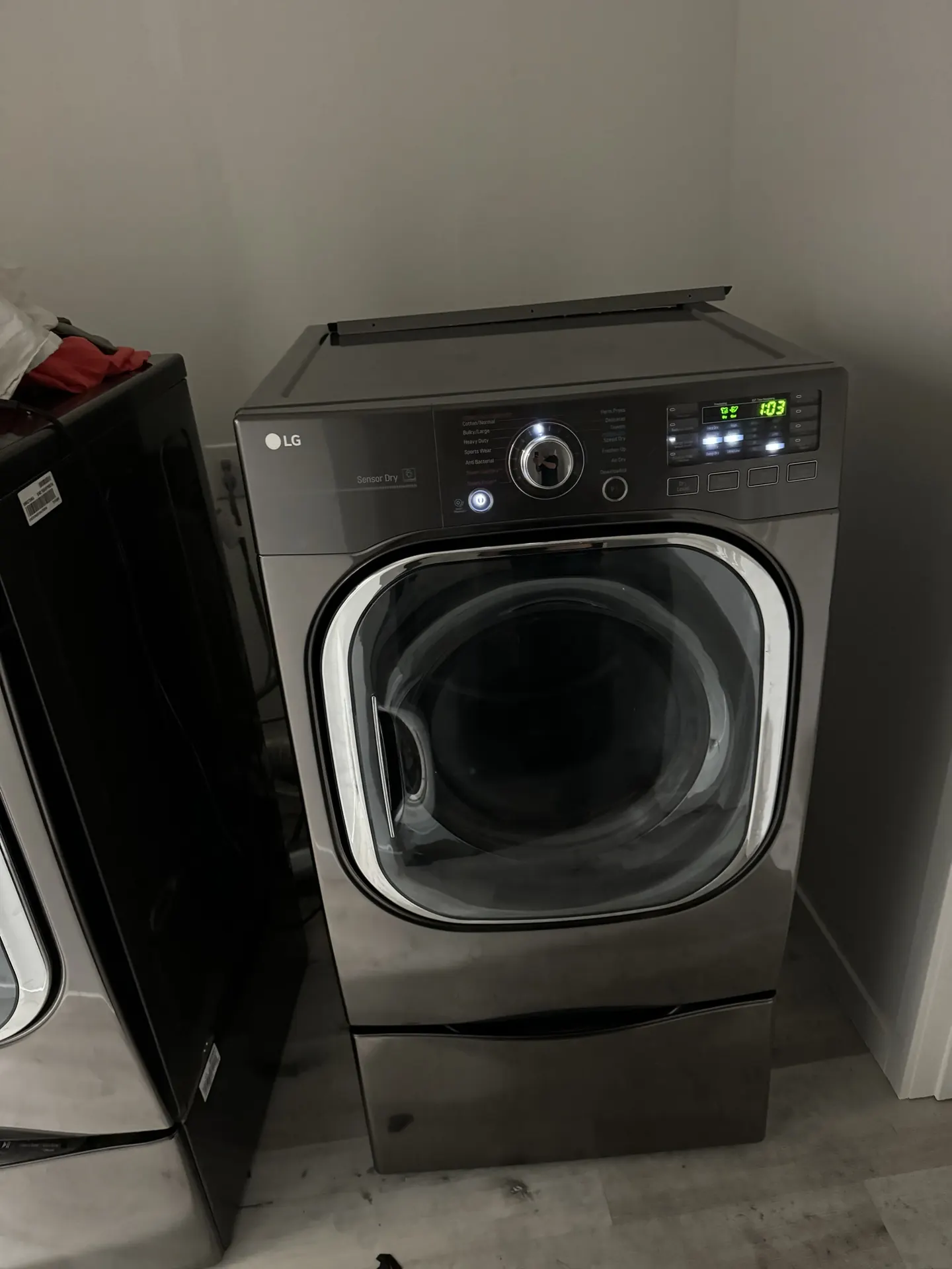 An LG dryer pulled out for repair